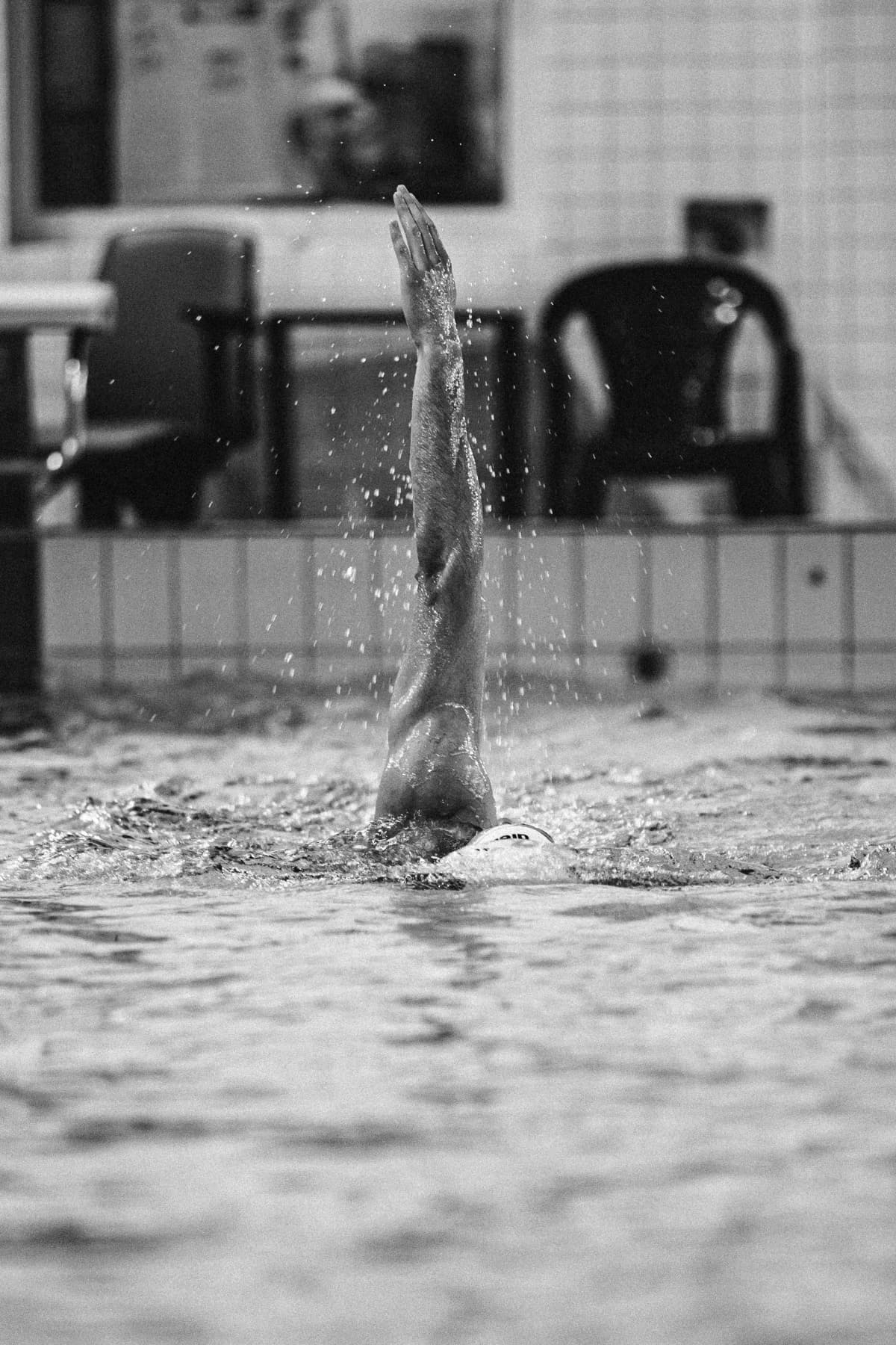 Swimmer training in an indoor pool